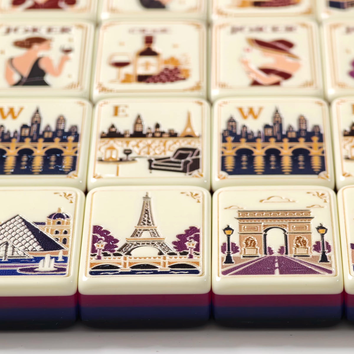 Close-up of engraved Paris Reverie mahjong tile faces