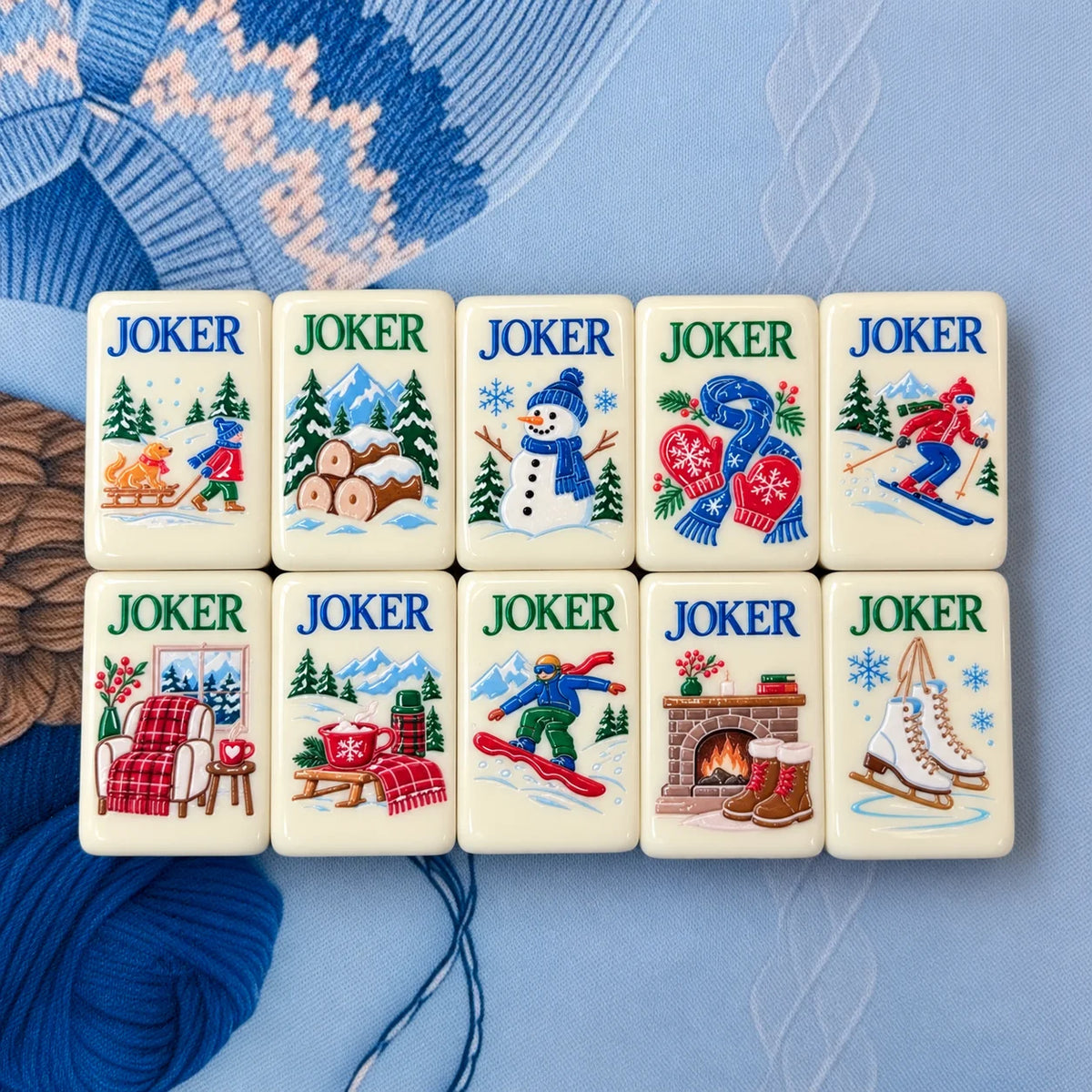 Snowfall Reverie holiday Joker tiles with snowmen, winter scenes and Christmas illustrations on blue fabric
